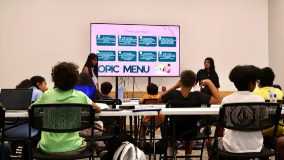 A workshop presentation with a 'Topic Menu' data science slide on screen