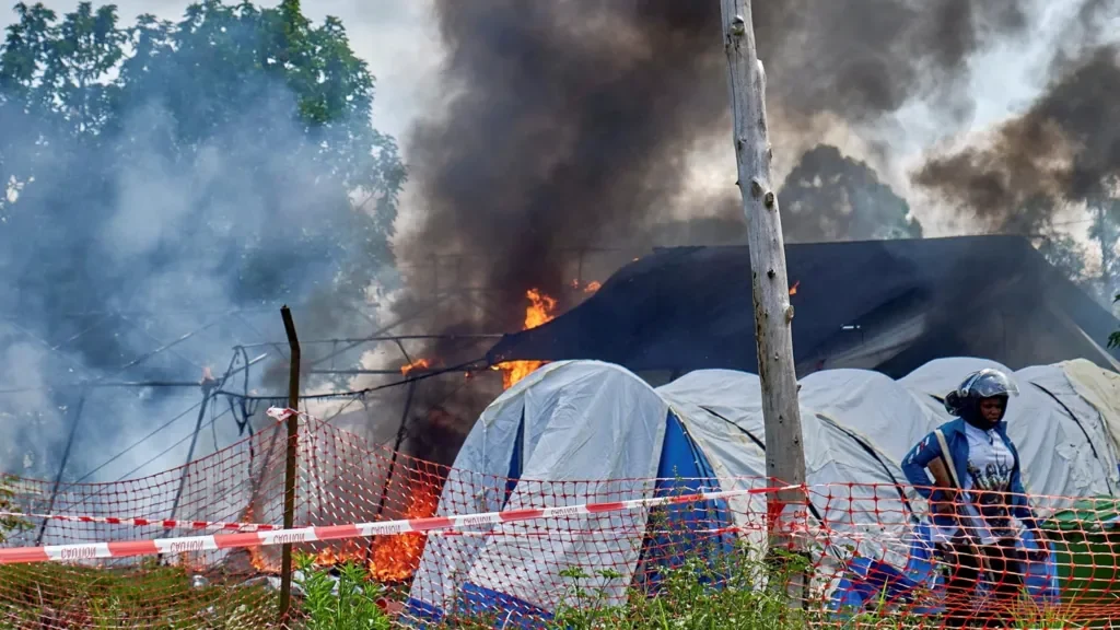 A treatment tent burning during unrest in the Democratic Republic of the Congo