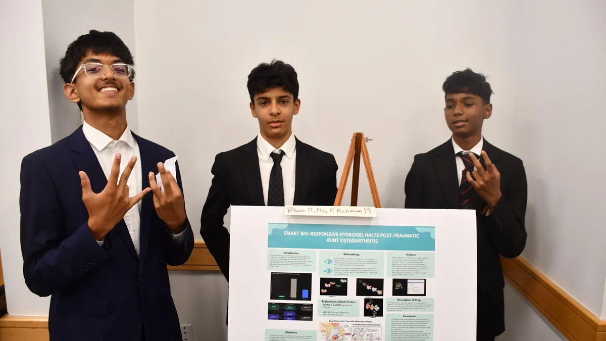 A group of students posing together at the Research Academy