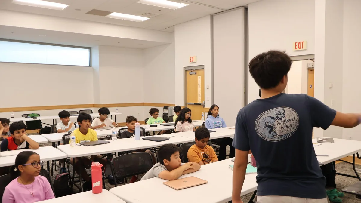 Students working on laptops during a workshop