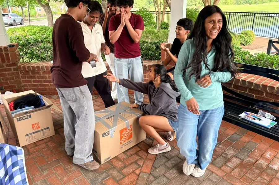 The team packing sorted clothing into boxes