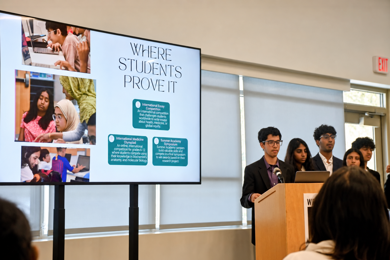 FutureVitals students presenting research opportunities at a symposium