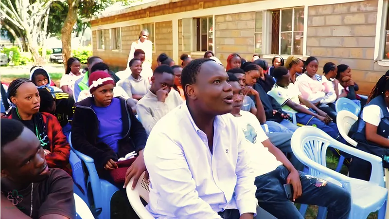 Community members gathered outdoors for a Vital Voices discussion