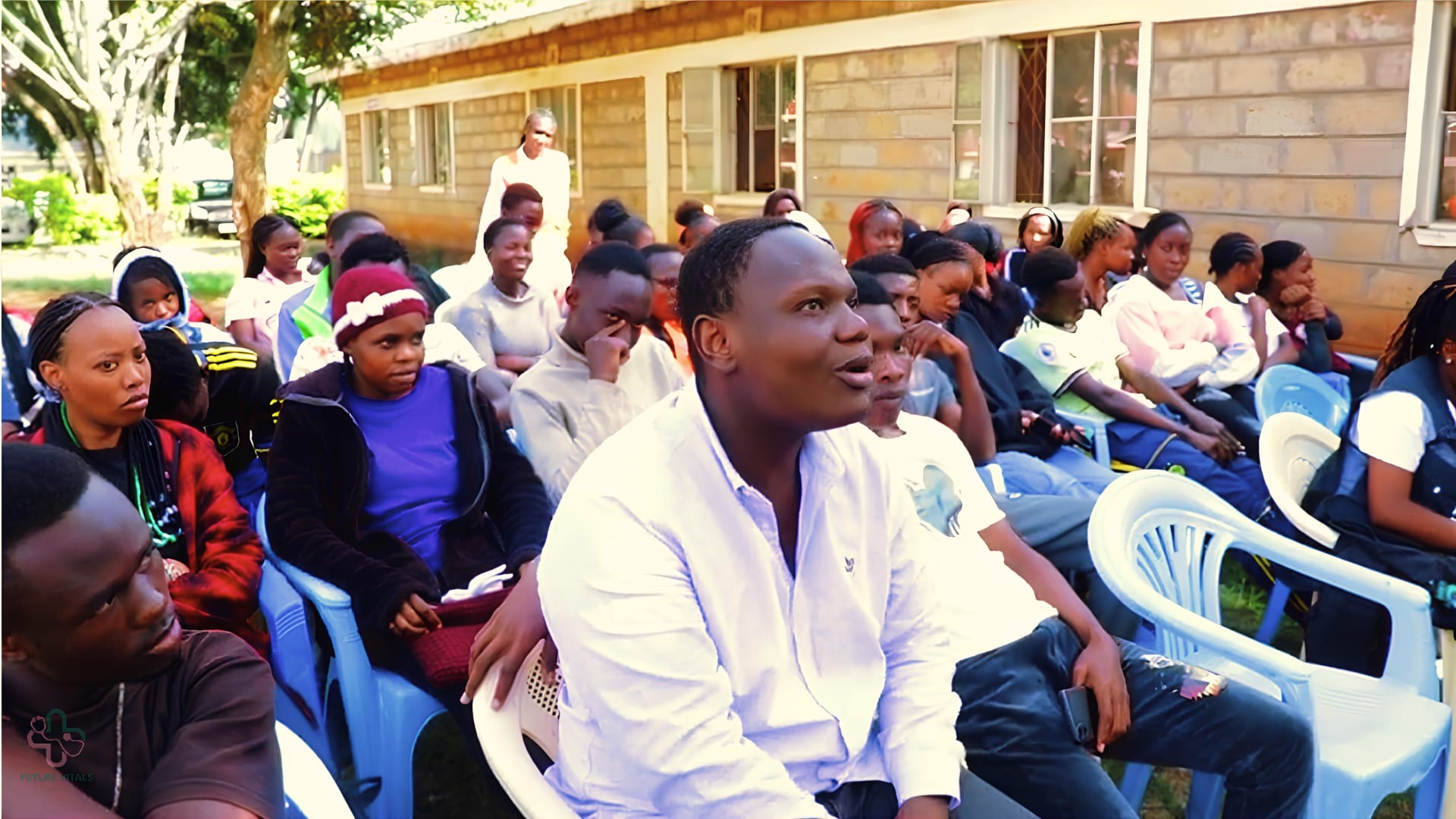 Community members gathered outdoors for a Vital Voices discussion