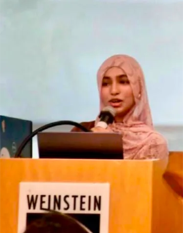Zaina Khan, Chief Executive Officer and Founder of FutureVitals, speaking at a podium