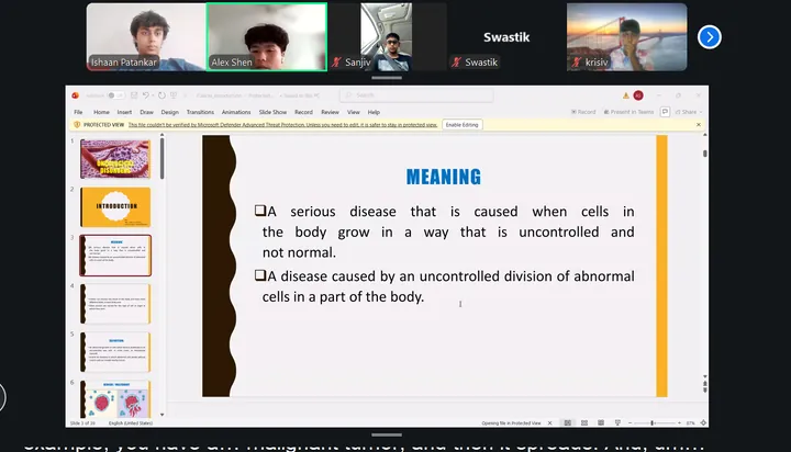 Students on a live call while the instructor presents a slide defining cancer