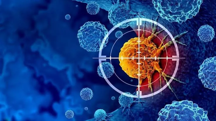 Illustration of a cancer cell in a target's crosshairs among immune cells