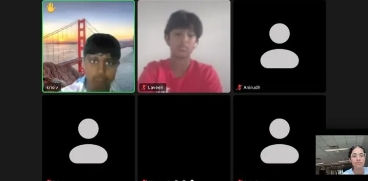 Students on a live video call, one with a raised hand
