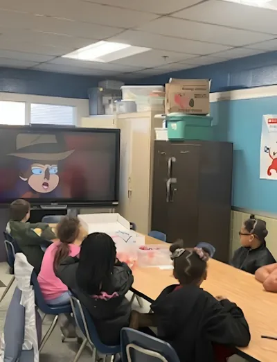 Students watching a presentation in a classroom