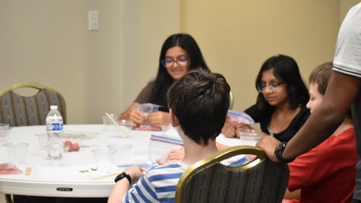 Students at the strawberry DNA extraction workshop