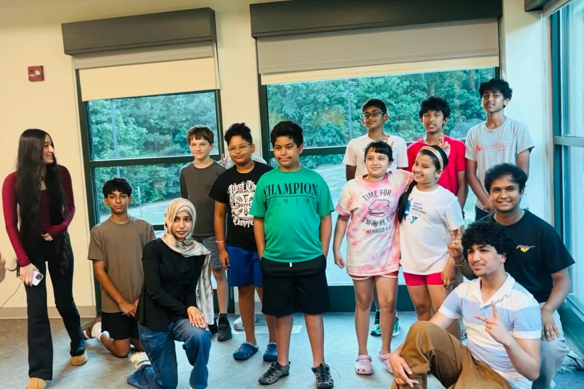 Students and volunteers together at the end of a workshop session